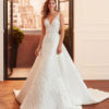 LUCIANA Sheath-style wedding dress and train in brocade and lace with beading, V-neckline and back with sheer inserts.