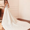 LUCIANA Sheath-style wedding dress and train in brocade and lace with beading, V-neckline and back with sheer inserts.