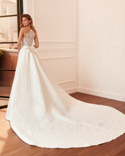 LUCIANA Sheath-style wedding dress and train in brocade and lace with beading, V-neckline and back with sheer inserts.